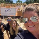 Eagle Dental in front of new location sign